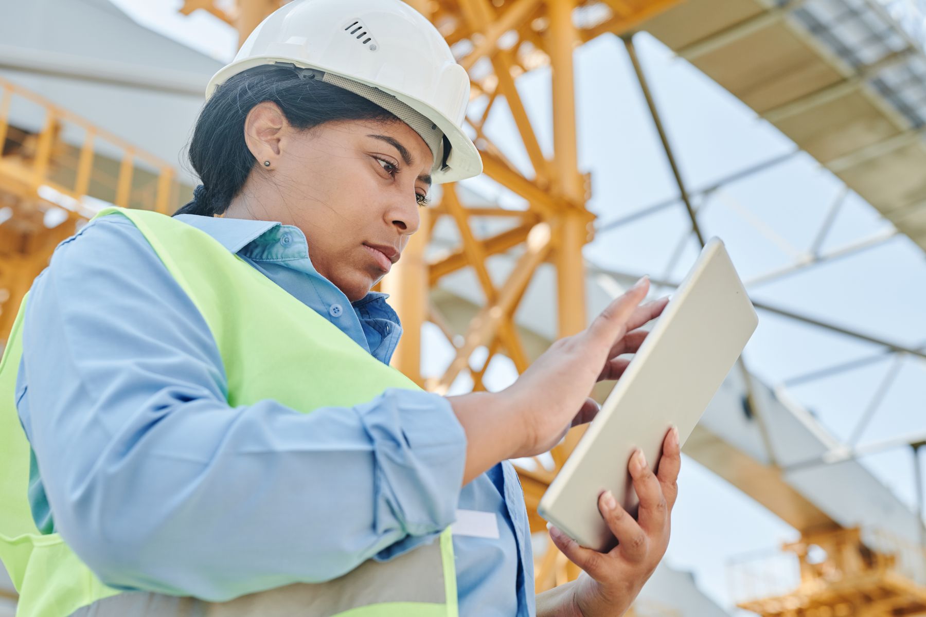 Field engineer using a tablet at a construction site